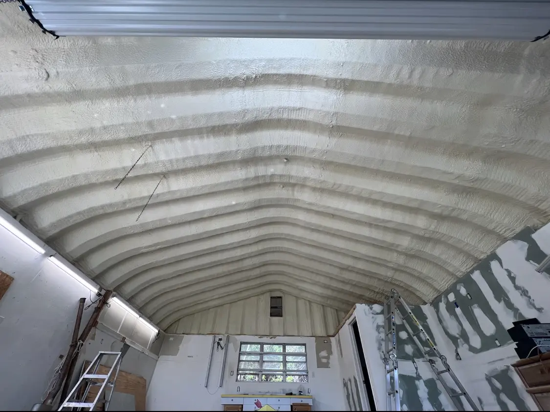Spray polyurethane foam applied to the underside of a metal roof deck in Cedar Mill